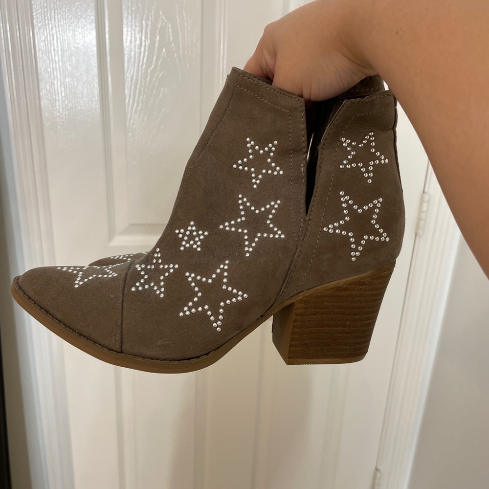 Brown booties star studded.